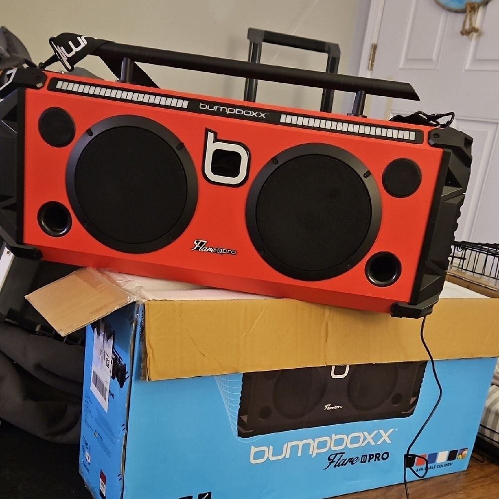 Red and Black Portable Boombox with Retro-Modern Design